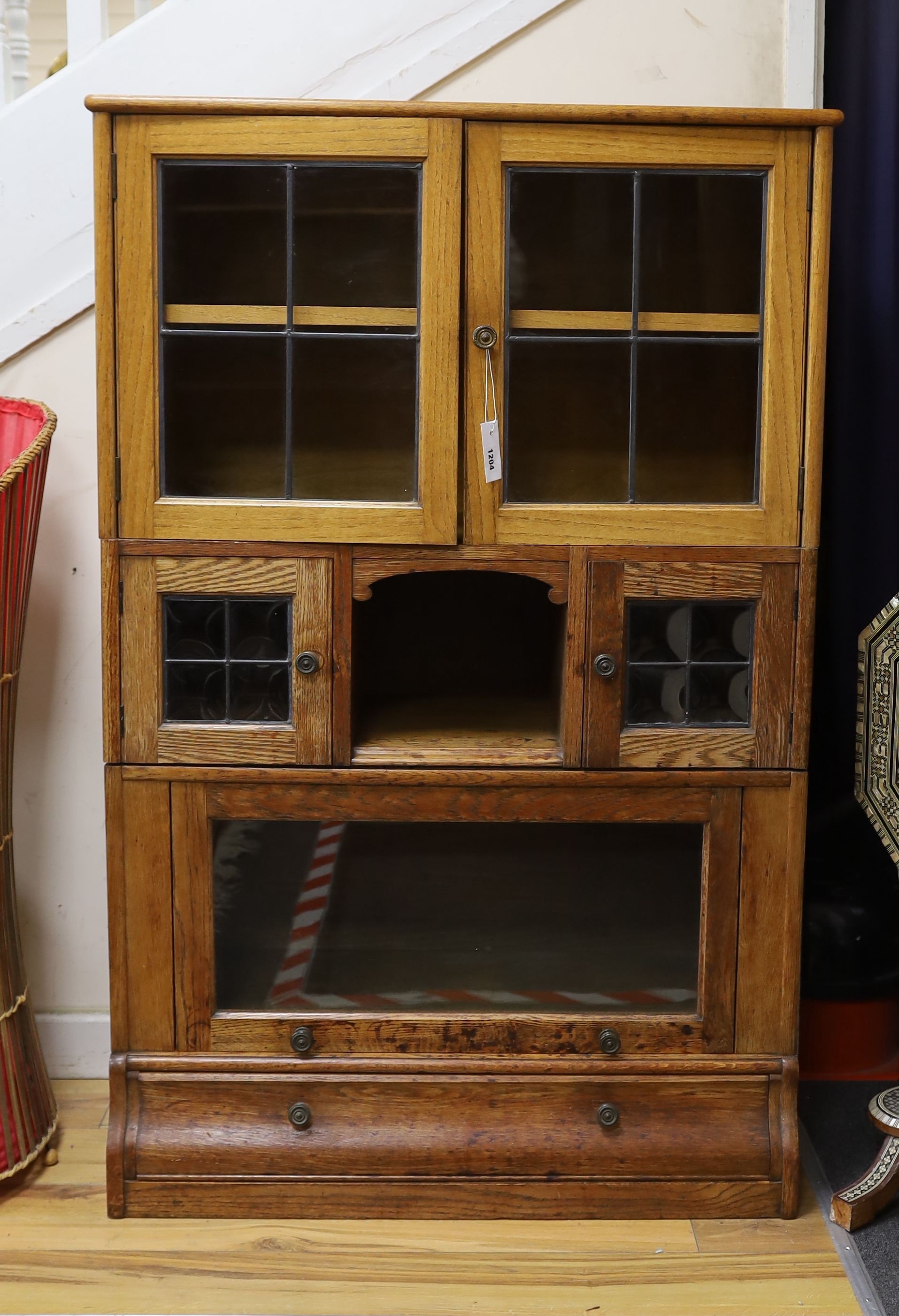 An early 20th century oak Globe Wernicke style four section oak bookcase, length 88cm, depth 36cm, height 136cm